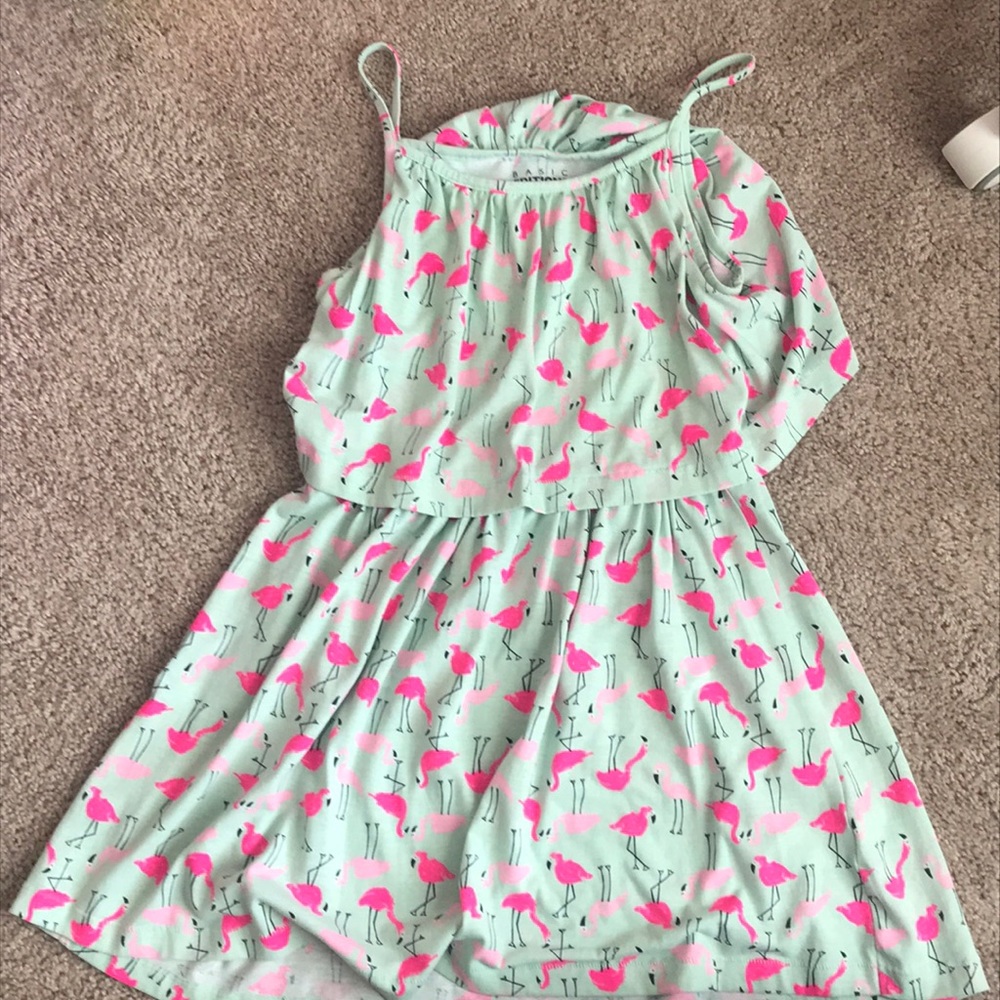 Pink flamingo dress with thin straps.